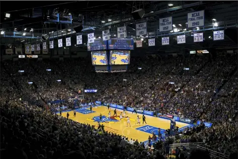  ?? REED HOFFMANN — THE ASSOCIATED PRESS FILE ?? Kansas and Baylor take part in a game at Allen Fieldhouse in Lawrence, Kan. For coaches, lawyers and other leaders in college basketball, the approach of the upcoming 2019-2020season has been nothing like business as usual.