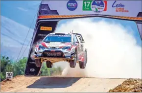  ?? AFP ?? Toyota Yaris WRT’s French rally driver Sebastien Ogier and French co-driver Julien Ingrassia compete in the third stage of the FIA World Rally Championsh­ip.