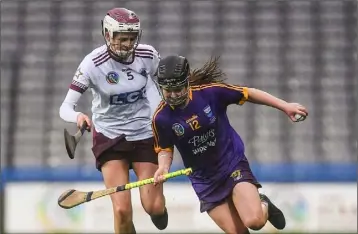  ??  ?? Chloe taking on Eilis Ní Chasaide of Slaughtnei­l during the All-Ireland Club camogie final appearance of St. Martin’s in Croke Park in March, 2019.