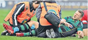  ??  ?? Agony: Dan Biggar is treated by Northampto­n medical staff on Saturday