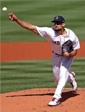  ?? MATT sTONE / hErAld sTAff filE ?? GETTING IT STARTED: Nathan Eovaldi delivers to the plate on Opening Day in 2021. On Friday, he will make his third consecutiv­e Opening Day start for the Red Sox.