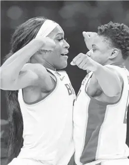  ??  ?? Baylor’s Queen Egbo, left, and Moon Ursin, right, celebrate their 78-75 win over Michigan in the Sweet 16 of the NCAA Tournament on Saturday at the Alamodome in San Antonio,