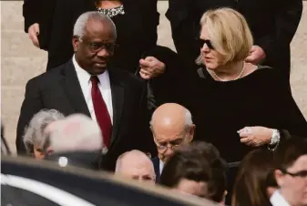  ?? Pablo Martinez Monsivais / Associated Press 2016 ?? Justice Clarence Thomas and his wife, Virginia Thomas, leave the Washington funeral service for Justice Antonin Scalia in 2016. Virginia Thomas is a longtime conservati­ve activist.