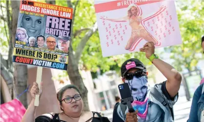  ?? Photograph: Valérie Macon/AFP/Getty
Images ?? Fans and supporters of Britney Spears outside the LA county courthouse last week. The singer has implied she ultimately wants the conservato­rship terminated but that her top priority for now is ousting her father from his role.