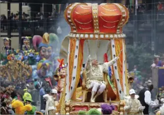  ?? GERALD HERBERT, THE ASSOCIATED PRESS ?? Rex, the King of Carnival, rides in the Krewe of Rex as he arrives at Canal St. on Mardi Gras day.