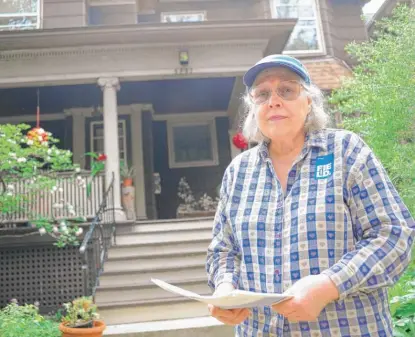  ?? VICTOR HILITSKI/ FOR THE SUN- TIMES ?? Josephine Sennet recently received a letter from the Cook County assessor’s office stating that the estimated market value of her home had shot way up. That’s likely going to mean a big increase in her property taxes.