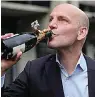  ?? The Associated Press ?? ■ German scientist Benjamin List, who won the Nobel Prize for chemistry, drinks champagne Wednesday at the Max-Planck-Institute for Coal Research in Muelheim, Germany.