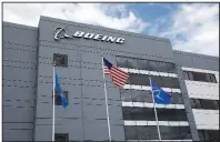  ?? AP/SUE OGROCKI ?? Boeing Co.’s third-quarter earnings plummeted as costs of the 737 Max grounding climbed.