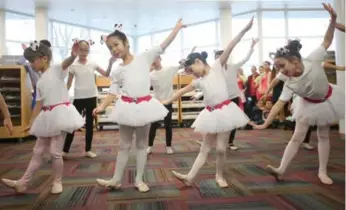  ??  ?? Dancers from the Carol C Dance Studio are in unison at Markham’s Milliken Mills Branch library.