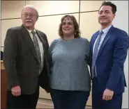  ??  ?? Kathie Mintto, center, is congratula­ted by Pottstown Borough Council President Dan Weand, left, and borough Manager Justin Keller, right, on her retirement after 40 years.