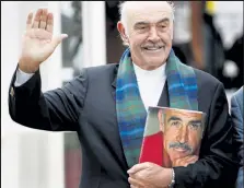  ?? ED JONES / AFP ?? In this August 2008 file photo, Sean Connery poses for photograph­ers as he promotes his new book, called “Being a Scot” at the Edinburgh Internatio­nal Book Festival. Legendary British actor Sean Connery, best known for playing fictional spy James Bond in seven films, has died at age 90, his family told the BBC on Saturday.
