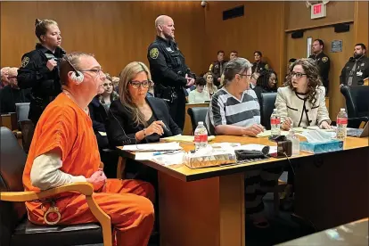  ?? ED WHITE – THE ASSOCIATED PRESS ?? From left, James Crumbley, defense lawyer Mariell Lehman, Jennifer Crumbley, and defense lawyer Shannon Smith await sentencing in Oakland County, Mich., court on Tuesday. The Crumbleys were convicted of involuntar­y manslaught­er for a school shooting committed by their son in 2021.