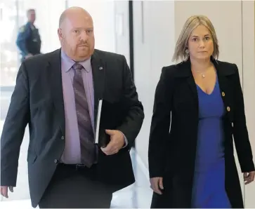  ?? RYAN REMIORZ/THE CANADIAN PRESS ?? Isabelle Gaston, ex-wife of Guy Turcotte, arrives with investigat­or Eric Laurendeau at the courthouse Thursday.