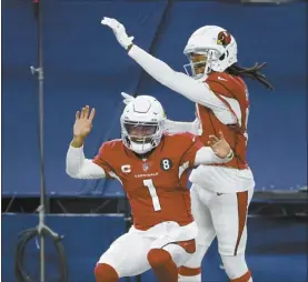  ?? AP photo ?? The Cardinals’ Kyler Murray and DeAndre Hopkins celebrate a touchdown scored on a carry by Murray in the third quarter of Arizona’s 38-10 victory over the Dallas Cowboys on Monday.