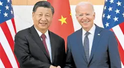  ?? —AFP ?? ALL SMILES Chinese President Xi Jinping (left) and US President Joe Biden shake hands as they meet on the sidelines of the G-20 Summit in Nusa Dua on the Indonesian resort island of Bali on Monday.