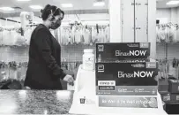  ?? Brett Coomer / Staff photograph­er ?? CVS is limiting over-the-counter COVID-19 tests to six bought online and four in stores because of customer demand.