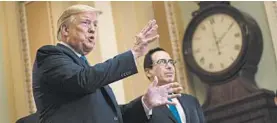  ?? EVAN VUCCI/AP ?? President Trump and Treasury Secretary Steven Mnuchin expect the economy to bounce back. “Our Economy will BOOM, perhaps like never before!!!” Trump declared Wednesday.