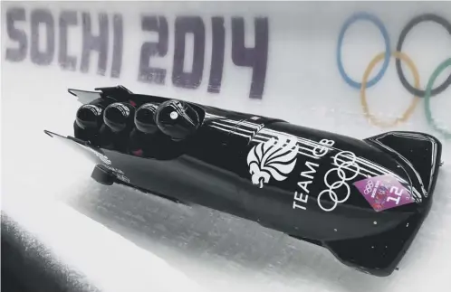  ??  ?? 0 John Jackson, Stuart Benson, Bruce Tasker and Joel Fearon of Great Britain 1 make a run during the 2014 Sochi Winter Olympics.