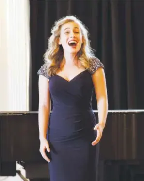 ??  ?? Clara Hevia, a high school student from Arlington, Mass., competes solo in the Schmidt Youth Vocal Competitio­n, the country’s most prestigiou­s nonprofit singing contest for aspiring vocal performers. Provided by University of Colorado