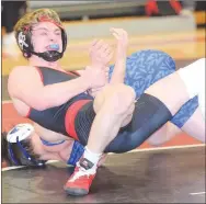  ?? RICK PECK/SPECIAL TO MCDONALD COUNTY PRESS ?? McDonald County's Oscar Ortiz nears a pin over Marshfield's Braedon Brooks in the 138-pound match during Marshfield's 40-36 win on Jan. 30 at MCHS.