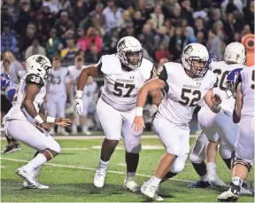  ?? STAN CARROLL, THE COMMERCIAL APPEAL ?? Offensive lineman Omari Thomas (57) blocks for Briarcrest against MUS on Friday.