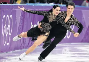  ?? AP PHOTO/JULIE JACOBSON ?? Tessa Virtue and Scott Moir of Canada perform during the ice dance, short dance figure skating in the Gangneung Ice Arena at the 2018 Winter Olympics in Gangneung, South Korea, Monday.