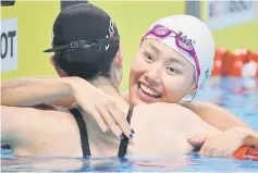  ??  ?? China’s Liu Xiang celebrates winning the women’s 50m backstroke final. — AFP photo