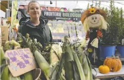  ?? ALLEN MCINNIS ?? Sophie Grumberg says reusable bags have been encouraged for years at Pure Horticultu­re, a produce stand at the Atwater Market.