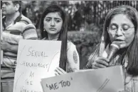  ?? CHANDAN KHANNA / AGENCE FRANCE-PRESSE ?? Indian journalist­s hold placards at a protest against sexual harassment in the media industry in New Delhi on Saturday.