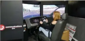  ?? BILL RETTEW - DIGITAL FIRST MEDIA ?? Rustin Senior Taylor Verrekia operates a driving simulator.