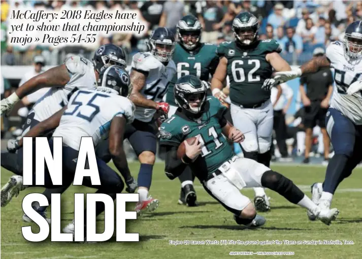  ?? JAMES KENNEY — THE ASSOCIATED PRESS ?? Eagles QB Carson Wentz (11) hits the ground against the Titans on Sunday in Nashville, Tenn.