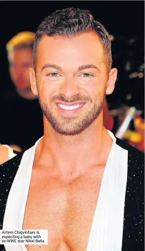  ??  ?? Artem Chigvintse­v is expecting a baby with EX-WWE star Nikki Bella