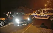  ?? Michel Euler / Associated Press ?? Police block a road after a teacher was decapitate­d and officers killed the assailant in Conflans-Saint-Honorine, France.