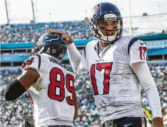  ?? Brett Coomer photos / Houston Chronicle ?? Rookie tight end Stephen Anderson, left, was on the receiving end of quarterbac­k Brock Osweiler’s second touchdown pass in Sunday’s 24-21 victory over the Jaguars.