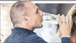  ??  ?? TOAST: Yanis Varoufakis drinks up after quitting his post Monday.