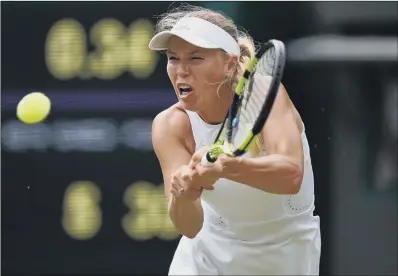  ??  ?? Caroline Wozniacki on her way to defeat against Ekaterina Makarova at Wimbledon yesterday.