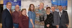  ?? (NWA Democrat-Gazette/Marc Hayot) ?? Staff from Camp Siloam celebrate winning the Jerry Cavness Non-Profit of the Year award during the banquet.