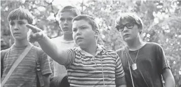  ?? UNIVERSAL FILMS VIA AP ?? Friends Gordie ( Wil Wheaton, left), Chris ( River Phoenix), Vern ( Jerry O’Connell) and Teddy ( Corey Feldman) are on a quest to find the body of a missing boy near their town in 1959.