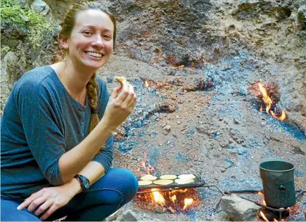  ?? STEVE AND ELIZABETH RILEY ?? American Samantha Deans looks forward to a billy tea and pancake fryup at the Natural Flames.