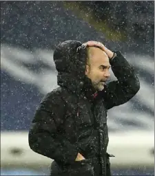  ?? POOL
AP PHOTO/DAVE THOMPSON, ?? Manchester City’s head coach Pep Guardiola stands on the touchline during the English Premier League soccer match between Manchester City and Newcastle United at the Etihad stadium in Manchester, Saturday.