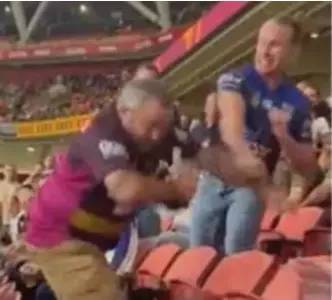  ?? ?? BIG BRAWL: An image from the viral video in which Wade Ruben Hornery is punched after his disrupted the minute's silence during an Anzac Day NRL match at Suncorp Stadium.