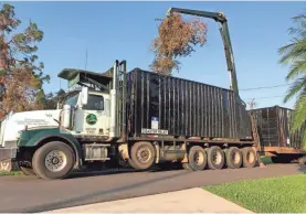  ?? RYAN CAREY / J CAREY LOGGING INC. ?? The loader arm of a log truck owned by J. Carey Logging Inc., based in Michigan’s Upper Peninsula, is used to dispose of hurricane debris near the Sebring/Lake Placid area of south-central Florida.