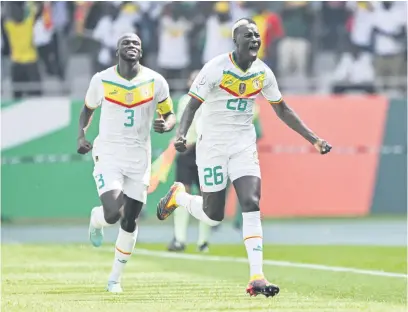  ?? Picture: AFP ?? ON THE WAY. Senegal’s Pape Gueye (right) celebrates with team-mate Kalidou Koulibaly after scoring a goal during their Africa Cup of Nations match against Gambia in Yamoussouk­ro yesterday.