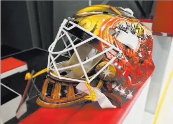  ??  ?? Shawn Hickey of Las Vegas won the fan contest to design goaltender Calvin Pickard’s mask. Hickey’s design has a medieval knight overlookin­g the Strip with a Golden Knights logo on the crown.