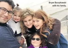  ??  ?? Bryan Borzykowsk­i with his family.