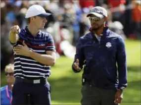  ?? CHRIS CARLSON — THE ASSOCIATED PRESS ?? United States vice-captain Tiger Woods talks to United States’ Jordan Spieth on the 16th hole during a practice round for the Ryder Cup golf tournament Thursday at Hazeltine National Golf Club in Chaska, Minn.