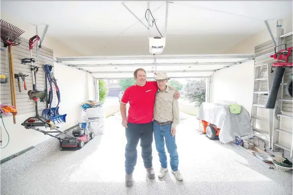  ?? JAMES PARK ?? Ottawa Garage Makeovers foreman Matt Bourne, left, with homeowner Brian Pringle, who had his garage renovated by the garage storage solution firm.