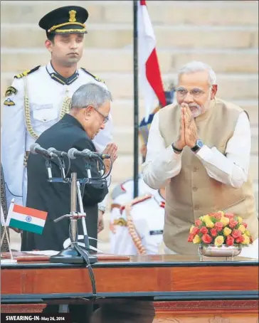  ?? AJAY AGGARWAL/HT ARCHIVE ?? ▪ SWEARING-IN- May 26, 2014 Prime Minister Narendra Modi greets then President Pranab Mukherjee at the swearingin ceremony in New Delhi.