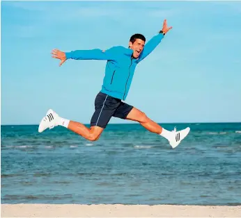  ?? — AFP ?? Novak Djokovic leaps in the air on Crandon Park beach to celebrate his 7-6 (3), 4-6, 6-0 victory over Andy Murray in the Miami Open men’s singles final.