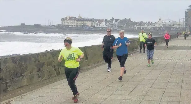  ??  ?? Competitor­s along the seafront stretch during the Porthcawl Parkrun last Saturday
